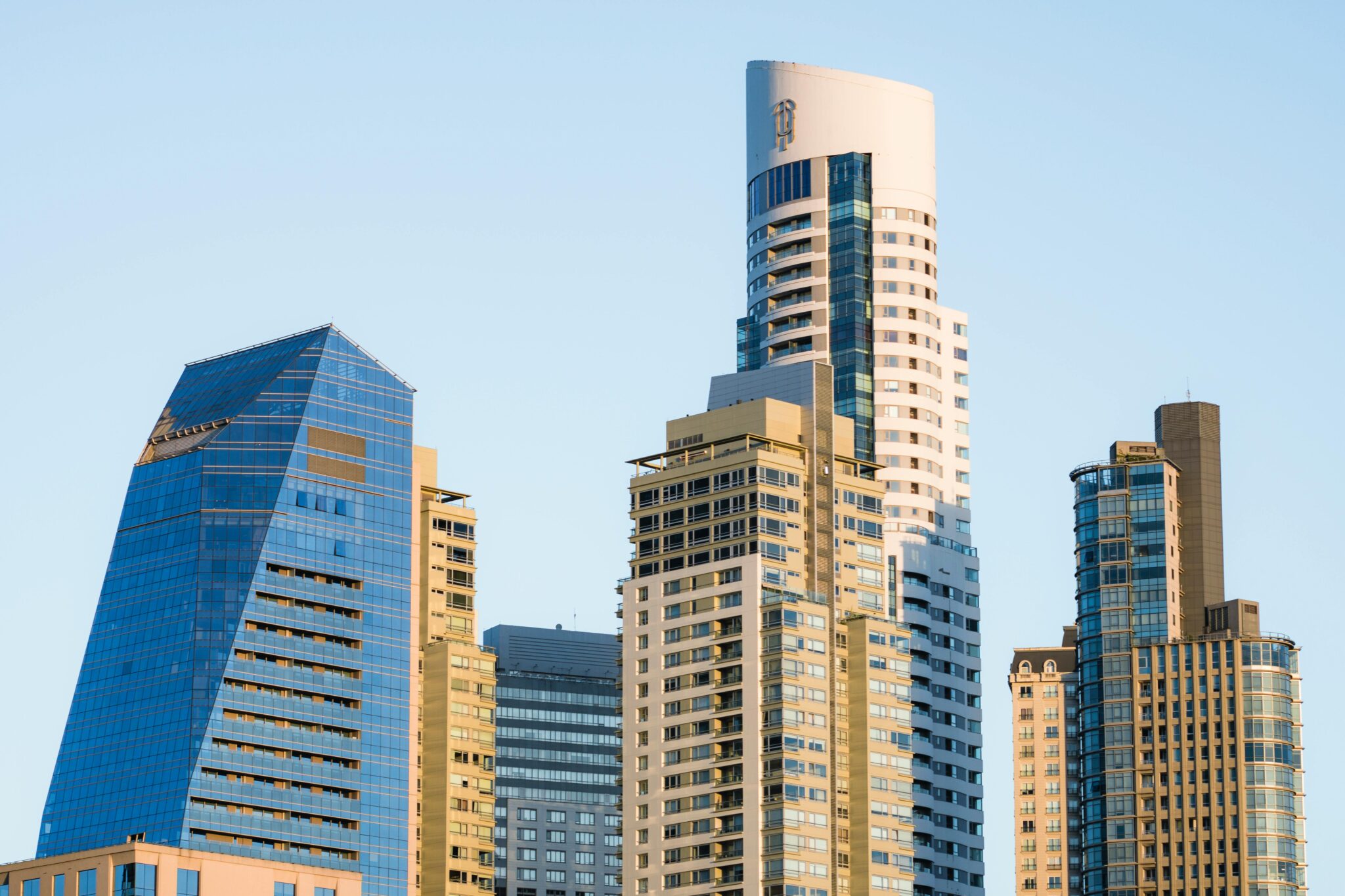 Contemporary skyscrapers in Buenos Aires with clear blue sky.
